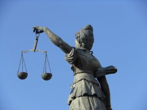 A statue of a woman holding the scales of justice.