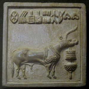 Figure 3.5 | Unicorn Seal | Mold from a “unicorn seal” from Mohenjo-Daro depicting a mythical animal standing over an altar or trough, with writing above.