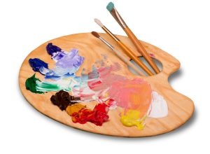 Artist palette with brushes on a white background.