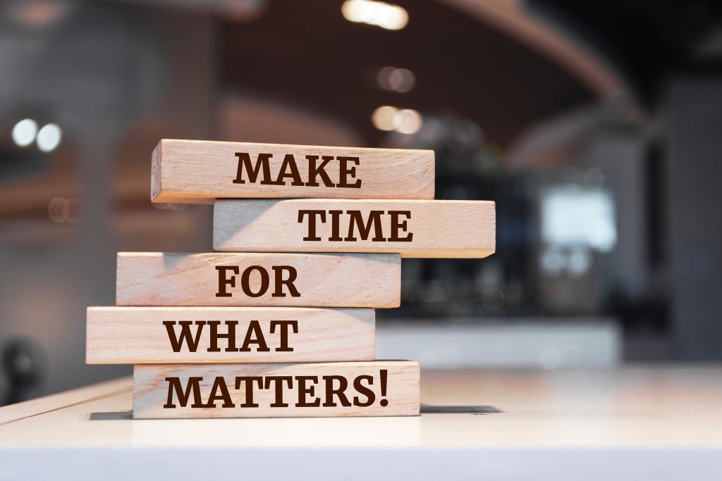 Stack of blocks with words stamped on them: reading "Make time for what matters!"