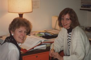 Two smiling women.