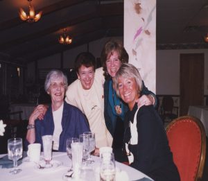 Four women at a dinner.