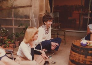 Two women sitting on the floor.