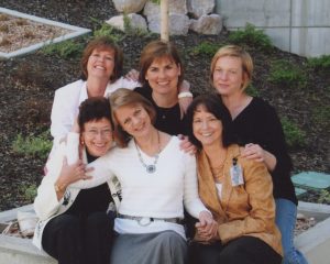 Six women smiling.