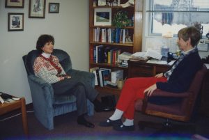 Two women sitting in chairs