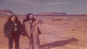 Two women standing outside