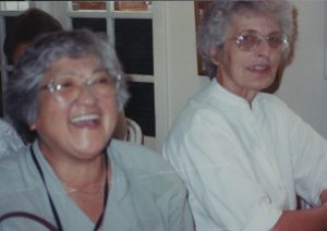 Two women laughing.