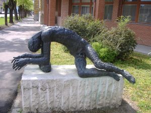A statue of a "tired man" resting.