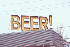 A large sign reading "BEER!" above a building