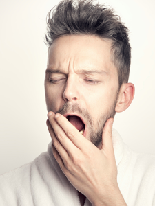 A man yawning