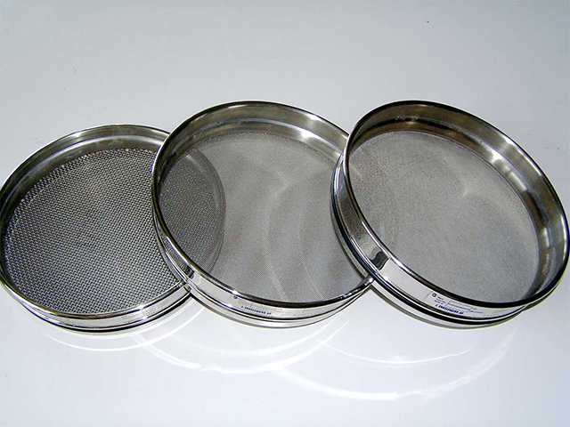 Photograph showing metal sieves.