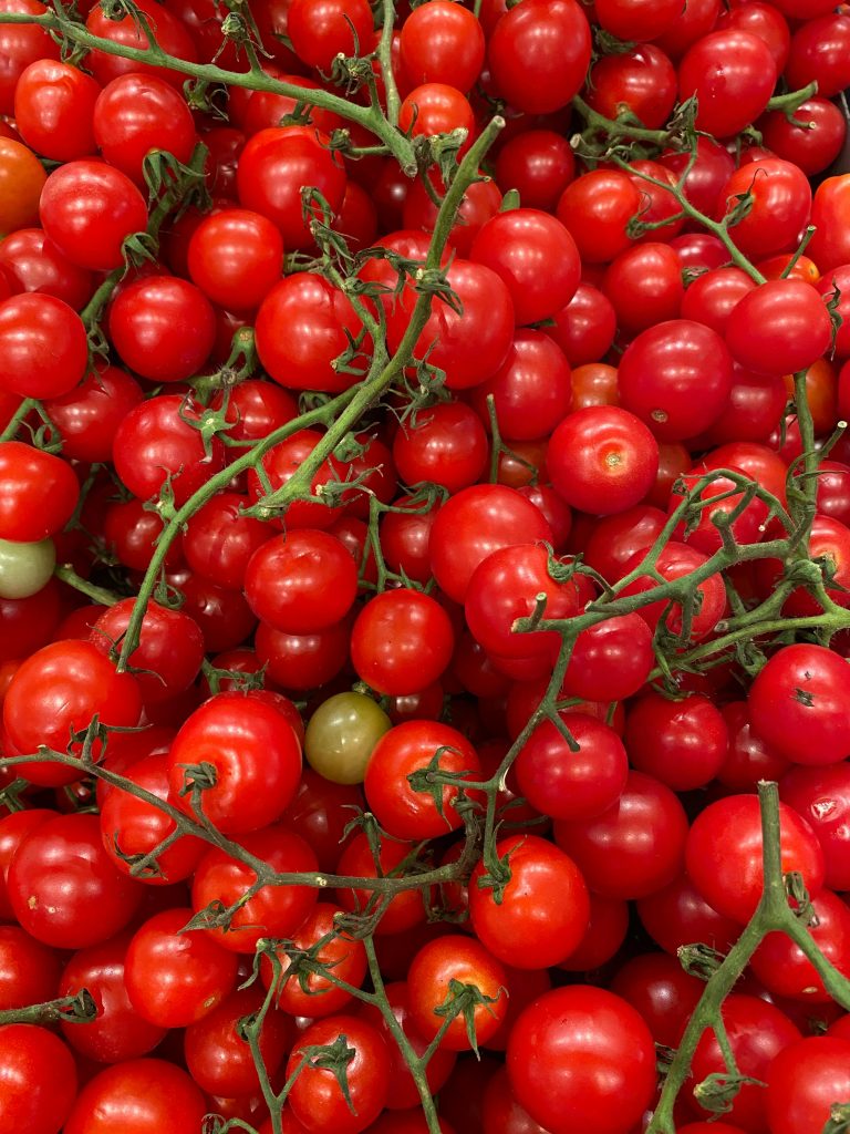 Abundance of Tomatoes Displayed at a Market