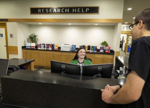 Librarian at research help desk