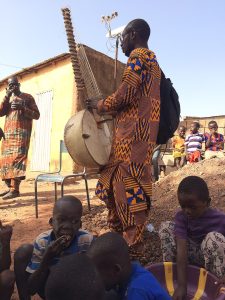 Image of a man holding a kora.