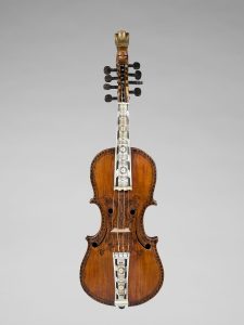 Hardanger fiddle with ornate inlays and a carved scroll.