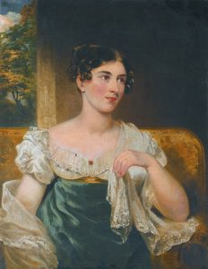 Portrait of a seated woman in a green dress with white lace sleeves, against a dark background with a partial landscape view.