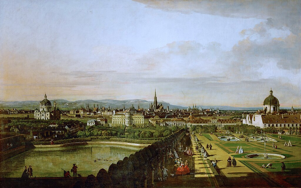 A panoramic view of Vienna with gardens, a large pond, and city buildings with domes and spires.