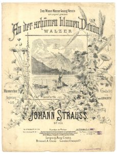 Vintage sheet music cover for "An der schönen blauen Donau" by Johann Strauss II with floral borders and a river scene illustration.