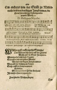 A page from a historic music book with blackletter German text and musical notation.