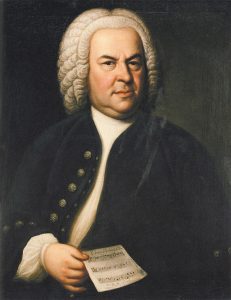 Portrait of Johann Sebastian Bach wearing a white wig and holding sheet music.