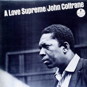 Black and white photograph of a man in profile with "A Love Supreme/John Coltrane" text.