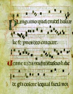 Medieval sheet music with gothic script on yellowed parchment.