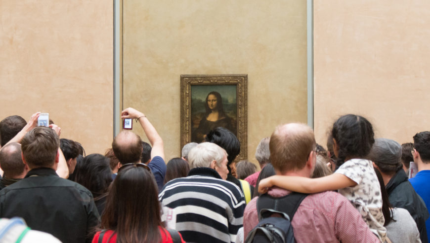 View of crowd surrounding Leonardo da Vinci, Portrait of Lisa Gherardini (known as the Mona Lisa), c. 1503–19, oil on poplar panel, 77 x 53 cm (Musée du Louvre, Paris; photo: -JvL-, CC BY 2.0)