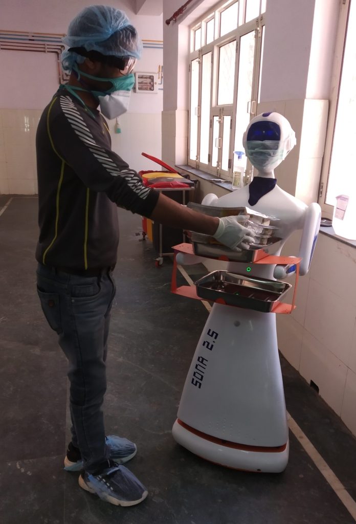Photo of a nurse assisting robot