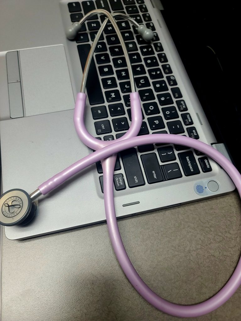 Picture of a stethoscope on a laptop keyboard
